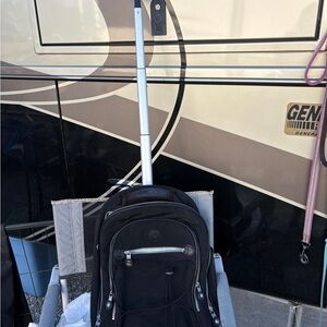 Kipling rolling black backpack